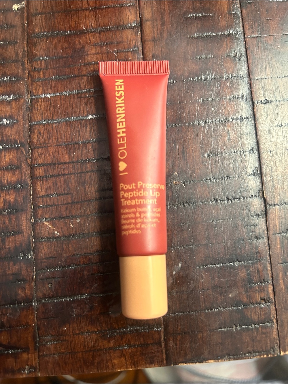 Ole Henriksen Pout Preserve Peptide Lip Treatment - Red tube with Peach Cap
